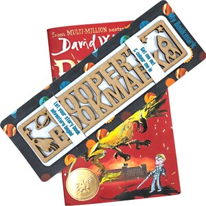 May include: A wooden bookmark with the words "Super Bookmark" cut out. The bookmark is on a colorful background with a rocket ship and planets. The text "Get me out & colour me in" is printed on the bookmark. The text "Let your story book adventure begin!" is printed on the back of the bookmark.
