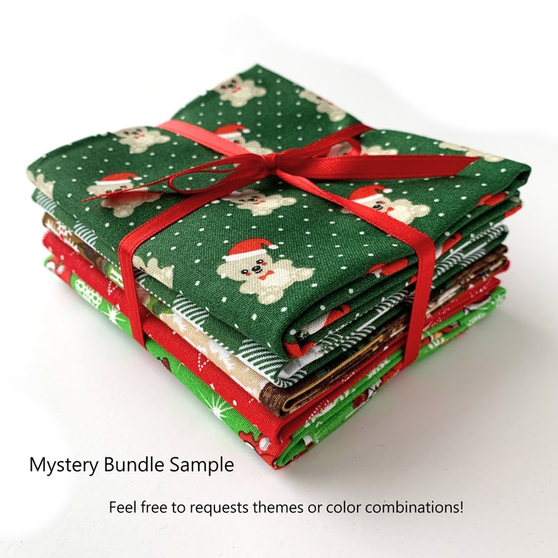May include: A stack of fabric squares with a Christmas theme. The fabric features a green background with white bears wearing Santa hats and red polka dots. The fabric is tied together with a red ribbon.