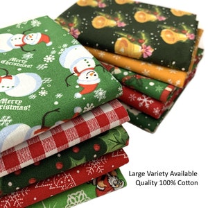 May include: A stack of eight Christmas-themed fabric squares in various patterns, including red and green plaid, green with snowmen, and green with holly. The fabric is 100% cotton and is available in a variety of patterns.