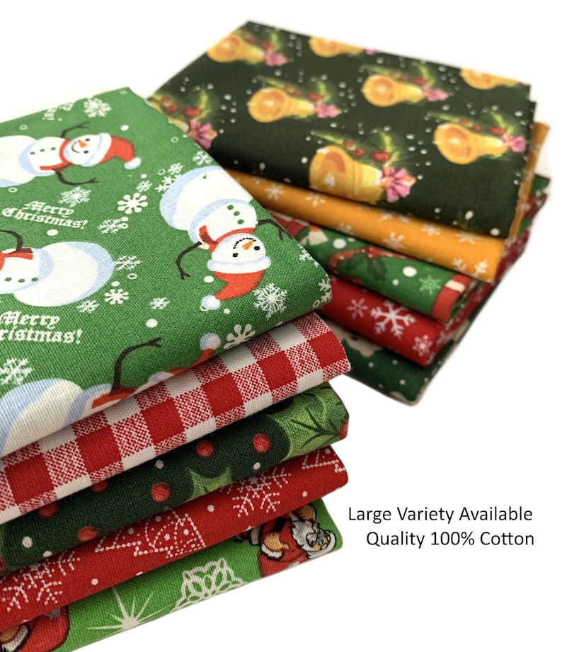 May include: A stack of eight Christmas-themed fabric squares in various patterns, including red and green plaid, green with snowmen, and green with holly. The fabric is 100% cotton and is available in a variety of patterns.