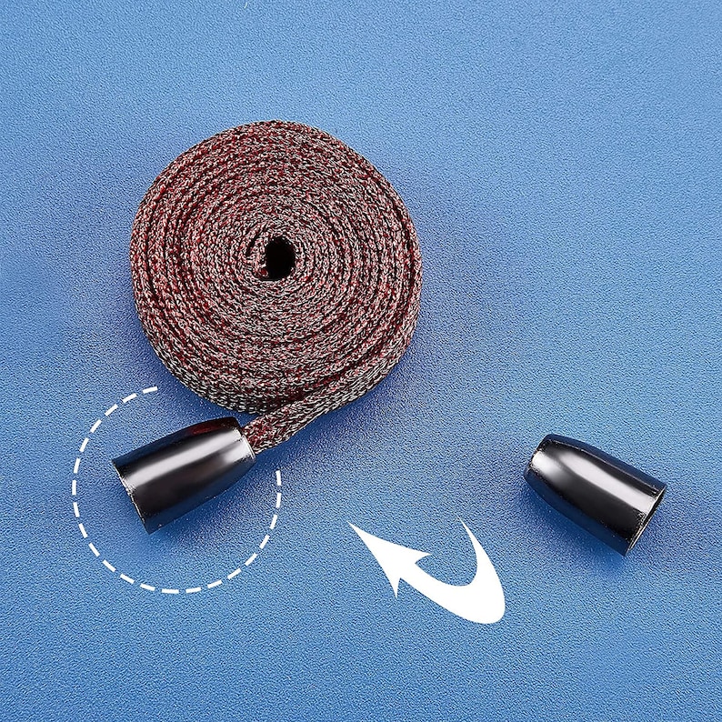 May include: A red and white braided cord with black plastic end caps. The cord is coiled and the end caps are visible.