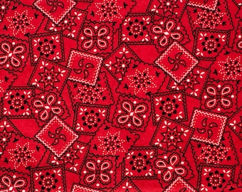 May include: A close-up of a red bandana fabric featuring a repeating pattern of square and paisley designs in black and white. The fabric's design is a classic Western style, suitable for craft projects or clothing.