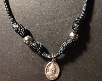 paracord saint medal necklace – tough – strong – rugged – St Sharbel – Blessed Virgin Mary – St Benedict – St Sebastian + sticker