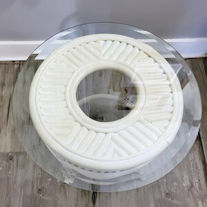 May include: White wicker end table with a round glass top. The table has a woven design and a circular opening in the center.