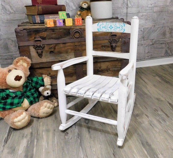 childs white rocking chair