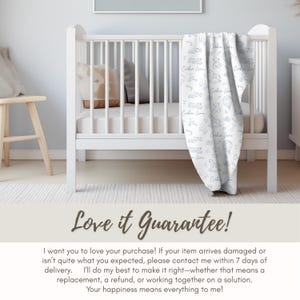 a crib with a blanket on it, placed in a nursery setting.