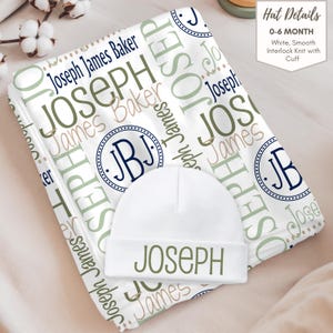 a white knit hat with the name "Joseph" printed on it, placed on top of a white blanket with the name "James Baker" printed on it.