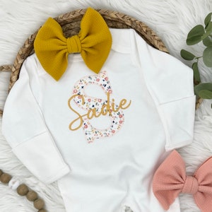 White and yellow sales outfit for baby shower