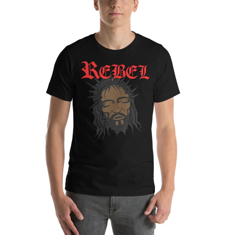 May include: Black t-shirt with a red "REBEL" graphic and a black and white image of a person with a crown of thorns.