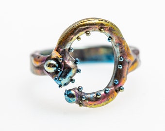 SunnyBlue. Snake Ring. Titanium Welded Ring. Unique piece. Hypoallergenic. Art Welding. Anodizing. Handcrafted in Finland