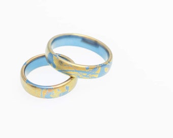 Sunny Blue. Titanium Wedding Rings by Tiqualia 2022.