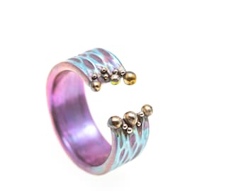 Magenta Blues. Titanium Ring. Textured Ring. Unique piece. Hypoallergenic. Art Welding. Anodizing. Handcrafted in Finland.