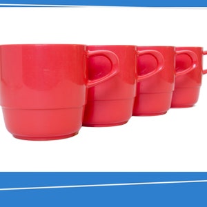 May include: Four bright red plastic mugs with handles. The mugs are stacked together in a row.