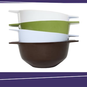 May include: A stack of four colorful bowls. The bowls are in shades of white, green, white, and brown. Each bowl has a handle on either side. The bowls are stacked on top of each other.