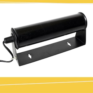 May include: Black metal lamp with a cylindrical shade and a wall mount bracket. The lamp has a cord and plug.