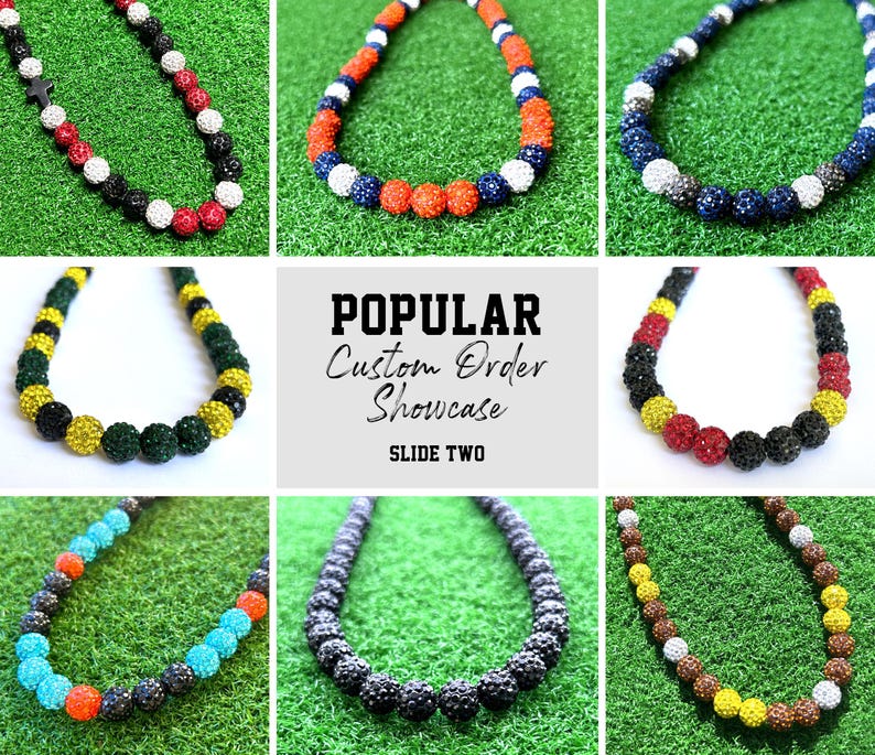 May include: A collection of colourful beaded necklaces with different colour combinations, including black, white, red, blue, yellow, and green. The necklaces are displayed on a green background with the text "POPULAR Custom Order Showcase SLIDE TWO".