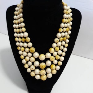 Vintage Multi-Strand Faux Pearl Necklace. Clasp stamped Hong Kong. Birds egg yellow beads.Boho. Four Strands. Elegant