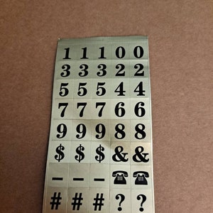 Vintage Checkway Numbers and Symbol Stickers. 40 stickers. Black on Gold. Includes numbers, telephone, dash, question mark and number sign.