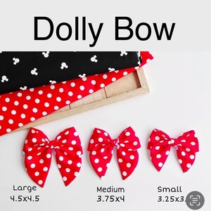 May include: The image displays red and white polka dot bows in three sizes: large (4.5x4.5 inches), medium (3.75x4 inches), and small (3.25x3 inches). The bows are arranged below fabric samples of black with white Mickey Mouse heads and red with white polka dots. The text "Dolly Bow" is at the top.