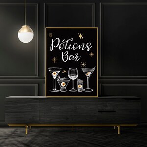 May include: Black chalkboard sign with gold trim and the text "Potions Bar" in white. The sign features a hand-drawn illustration of five cocktails with eyeball ice cubes.