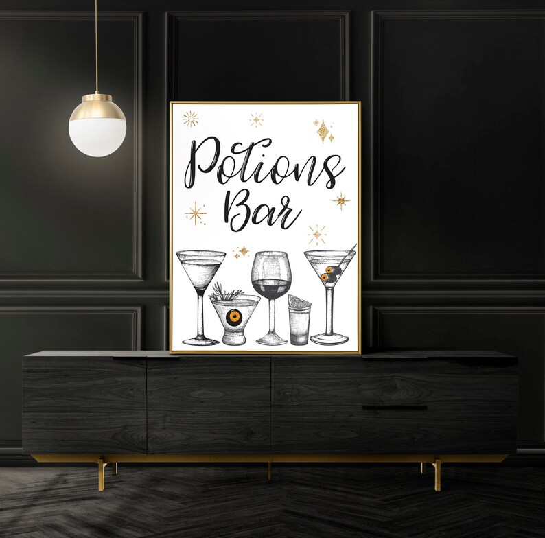 May include: A framed print with the words "Potions Bar" in elegant script, featuring detailed illustrations of various cocktail glasses. The artwork includes a martini, a wine glass, and other drinkware, with gold star accents.