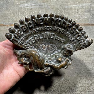Antique Cast Iron Advertising Tip Tray The Big New York Store Sterling Colorado, Fishman and Parker Bros, Woman with Feather Fan