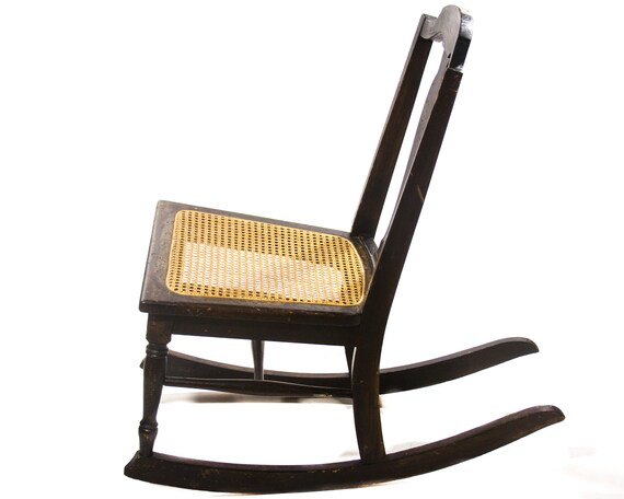 antique childs rocking chair with cane seat