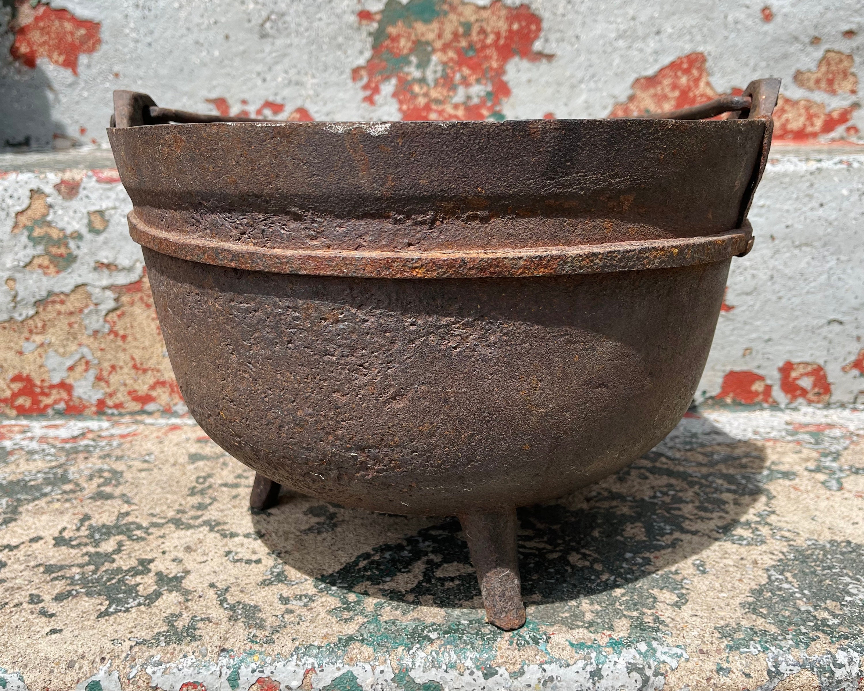 Antique cast iron cauldron for garden use