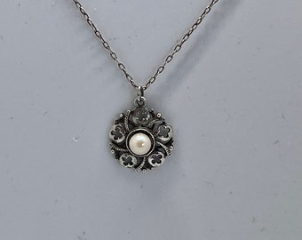 Silver flower pearl pendant on a silver 18 inch chain