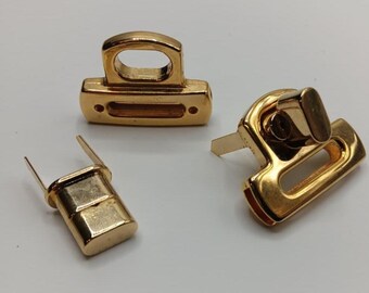 Purse Lock Clasp #4 with fold back tabs, turn lock twist lock fastener. Gold-tone over steel, high quality shine Purse/Bag Hardware Leather