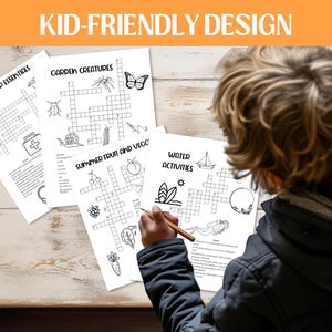 May include: A collection of black and white crossword puzzles with the text "ROAD TRIP ESSENTIALS", "GARDEN CREATURES", "SUMMER FRUIT AND VEGE", and "WATER ACTIVITIES". The image also includes the text "KID-FRIENDLY DESIGN".