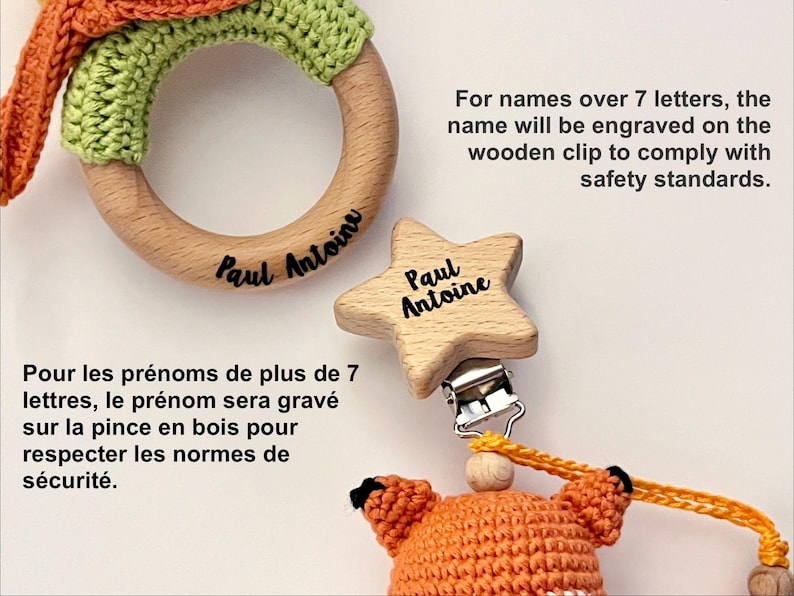 May include: A wooden teething ring with green crochet detail and the name Paul Antoine engraved, alongside a star-shaped wooden clip with the name Paul Antoine and a crocheted orange fox toy. Text states: For names over 7 letters, the name will be engraved on the wooden clip to comply with safety standards.