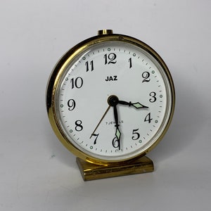 French vintage small alarm clock JAZ gold color reveil anne 60's glow in the dark brille la nuit 7 JEWELS