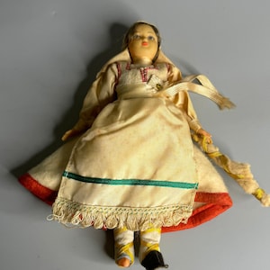 vintage celluloid doll in dress regional doll collectible