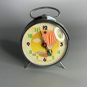 Chinese vintage alarm clock advertising Hero enamel green color and chrome