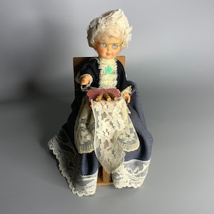 French vintage doll lady in chair design working on lace