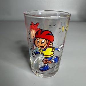 Francuski zabytkowy szklany kubek z wzorem rolki - Amora kolekcjonerska szklanka do wody dla dzieci z wzorem kreskówki