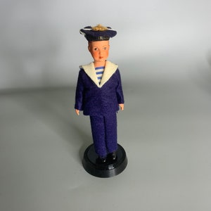 vintage doll sailor design with rotating base figurine