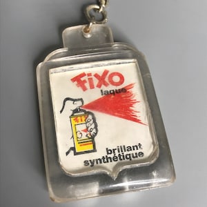French vintage keychain holder advertising Fixo Laque souvenir de Vendee