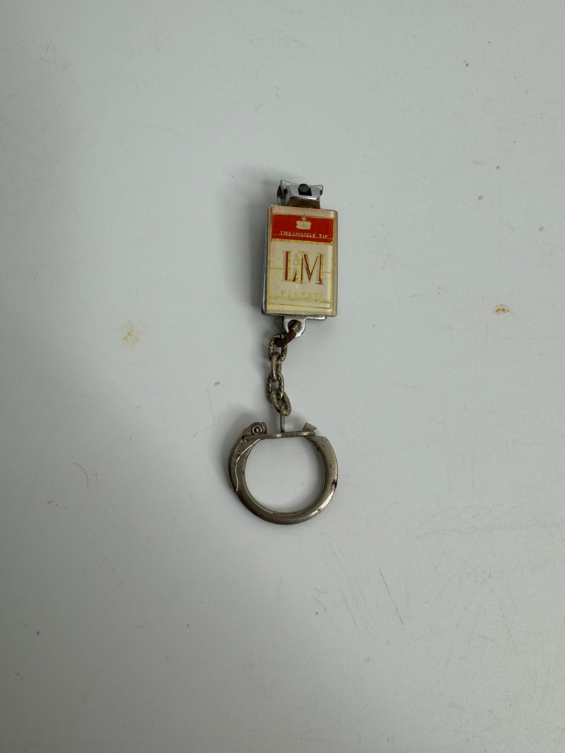 French vintage keychain holder advertising L&M cigarettes