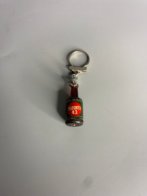 French vintage keychain holder advertising Pelfor… - image 1