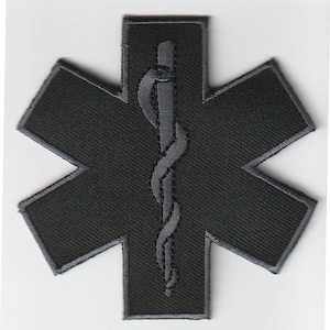 May include: Black embroidered patch with a gray medical symbol, a snake wrapped around a staff, in the center of a six-pointed star.