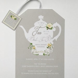 May include: A gray and white bridal shower invitation with a teapot and floral design. The invitation reads "Time for Tea with the Bride-To-Be" and includes the date, time, and location of the event. RSVP information is also included.