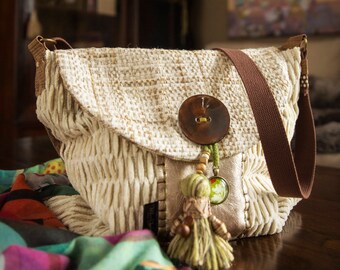 Unique messenger bag. Handmade using luxurious designer, upcycled textiles in shades of cream. Leather, wool and coconut button accents.