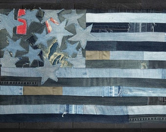 Handmade patchwork denim USA flag wall hanging. Made to order from recycled denim, vintage jeans, and upcycled upholstery fabric. 25x13".