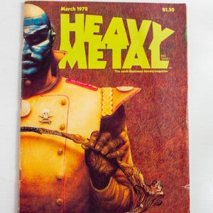 May include: Vintage "Heavy Metal" magazine cover from March 1978. The cover features a blue-skinned figure in a yellow uniform holding a detailed pipe. The magazine title is in large, neon yellow letters.