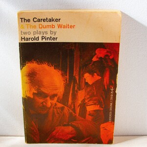 May include: A vintage paperback copy of Harold Pinter's plays, "The Caretaker & The Dumb Waiter". The cover has a sepia-toned image of two men. The title and author are in black and orange. The book is an Evergreen Original.