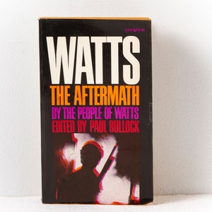 May include: A black book titled "Watts: The Aftermath" by the people of Watts, edited by Paul Bullock. The cover features a silhouette of a person holding a rifle in front of a fiery background.