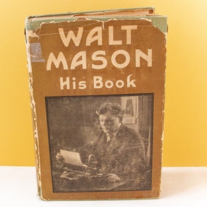May include: A vintage book titled "Walt Mason His Book" with a photo of a man typing on a typewriter.