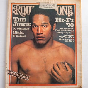 May include: A white ceramic mug with a black handle and the text "But First, Coffee" in a handwritten style. The mug is on a white surface. The mug is 10 cm tall.